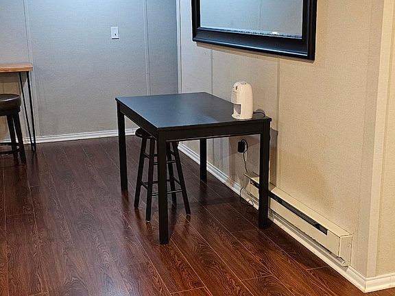 Open concept kitchen and living room with a table and a desk