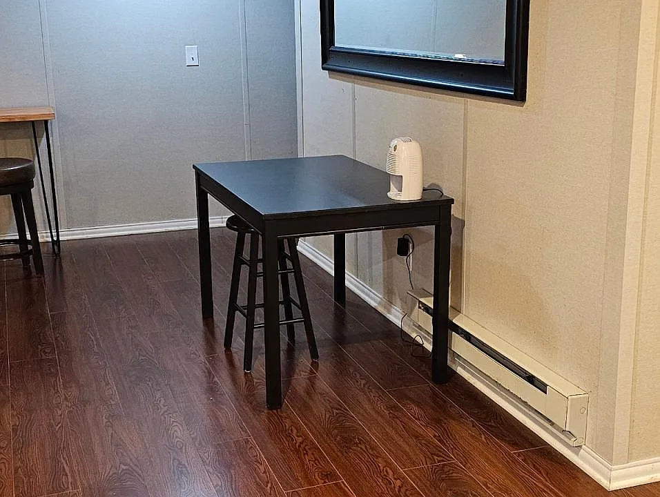 Open concept kitchen and living room with a table and a desk