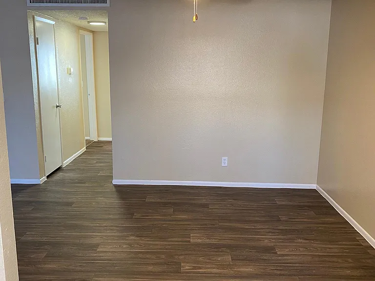 downstairs 2 bedroom - view of dining room with LED ceiling fan from kitchen