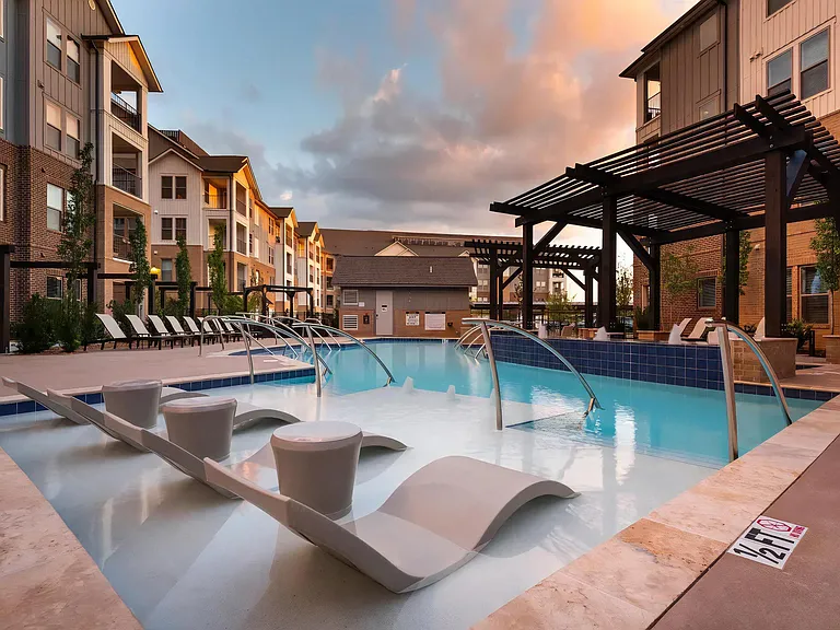 Spacious Pool Area with Ample Seating and Modern Landscaping