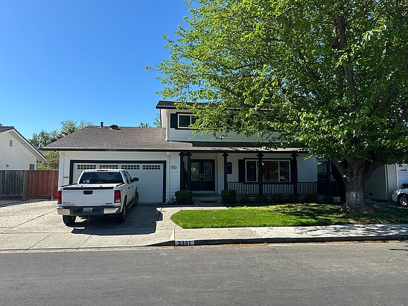 Front - newly painted. Large Fruitless Mulberry shade tree.