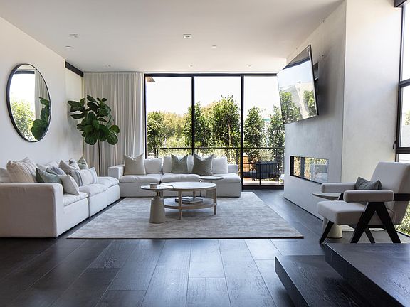 Living room view, 75" smart T.V. super comfy couches, terrace to Abbot Kinney