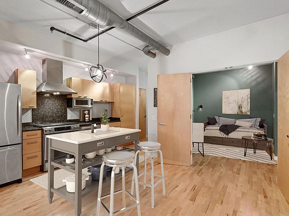 Den located off of the kitchen