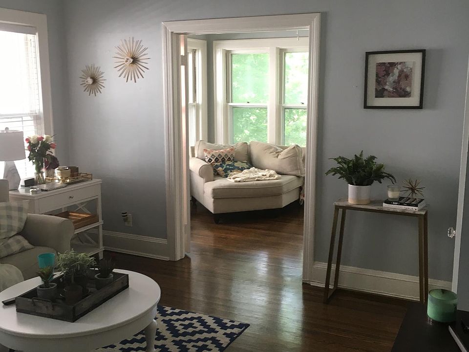Living room into sunroom with French doors and a large closet.