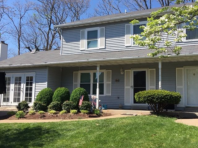 Front of the house complete with landscaping, new roof and N