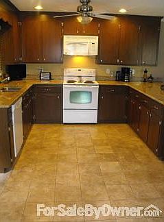 Spacious kitchen
						:
						Granite countertops and great, homemade cabinets.