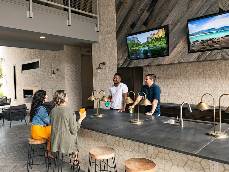 Outdoor lounge area with TVs