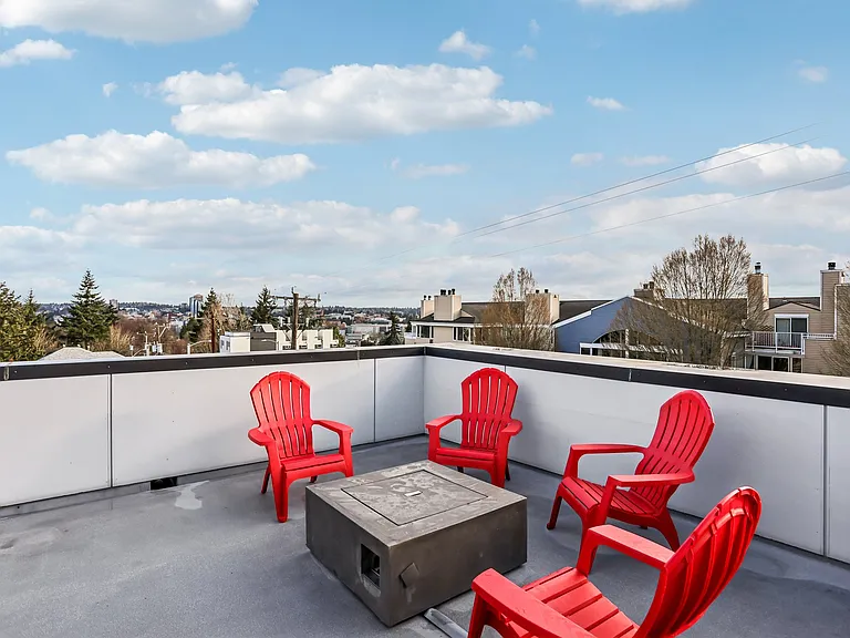 Huge roof-top deck with lake & mountain views includes a wet-bar, gas grill, and gas fire pit.