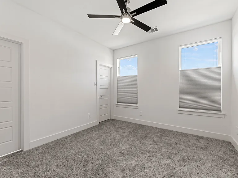 Bedroom 3 offers a large closet and access to the bathroom. It overlooks the backyard. Room dimension is 11' x 12'