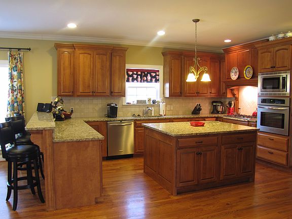 Kitchen including incredible island, gas stove, stainless appliances...