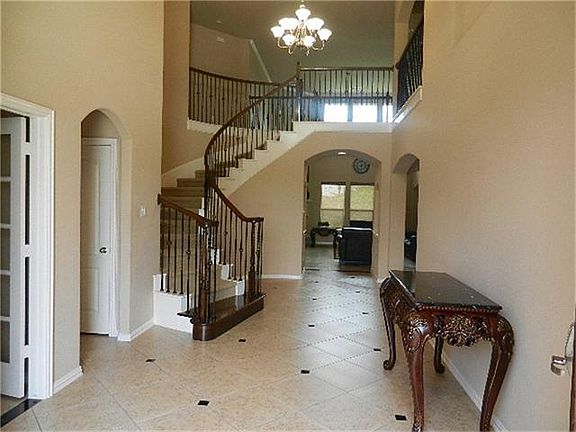 STAIRS WITH WRUOGHT IRON SPINDLES.