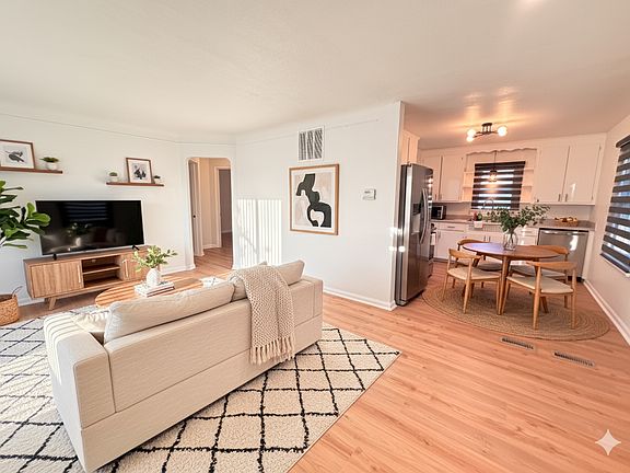 Seamless living_dining layout perfect for entertaining _ open sight lines to the kitchen and backyard.