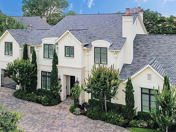 Just stunning! Soft contemporary elevation, lush landscaping and circular driveway add to the great curb appeal of this beautiful home.