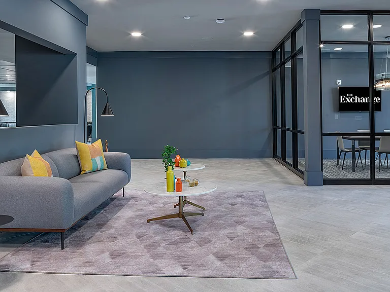 Immerse yourself in the sophisticated design of this modern lounge space, perfect for relaxation and work.