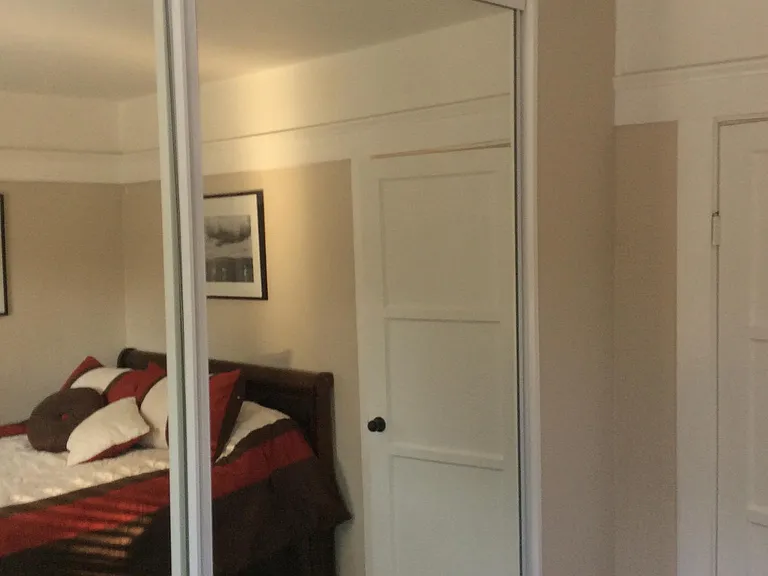 Fourth bedroom large mirrored closet.