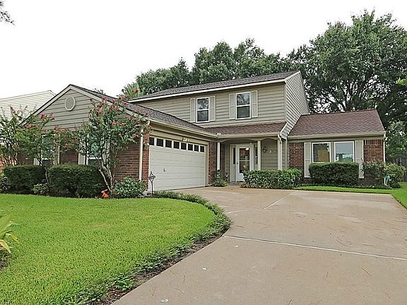 This home features a 2 car side entry garage, covered front porch, glass storm door, columns and a m