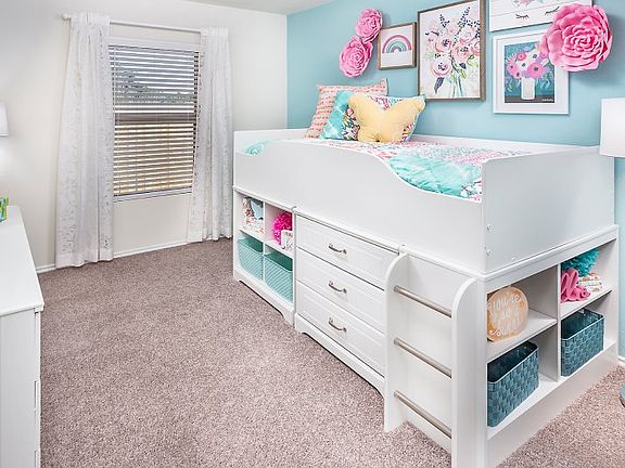 Two bedrooms are conveniently accessible from the main living space providing effortless transitions