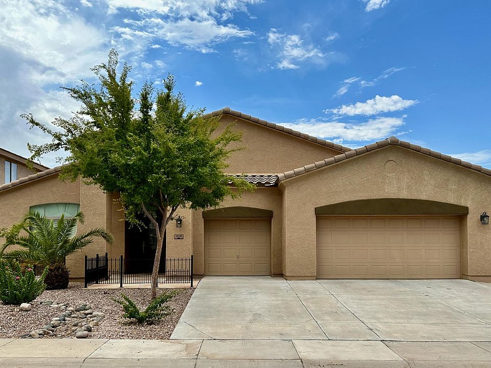 Home Front with 2.5 car garage - plenty of parking and storage for your cars and toys.