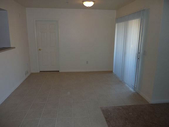 Dining room view is from the front door looking in. Tiled area.
