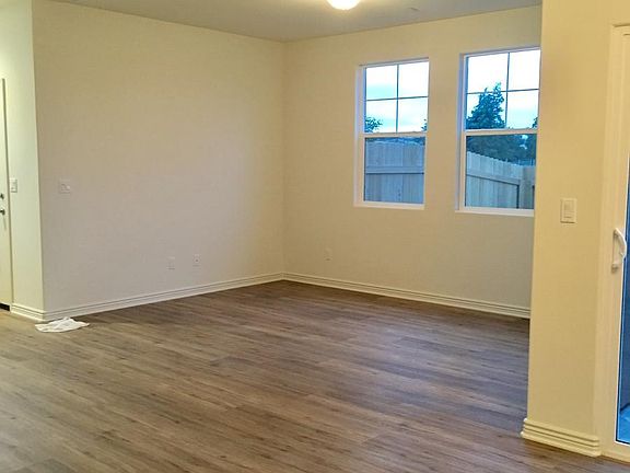 Easy to clean floors in the living room, with plenty of natural lighting.