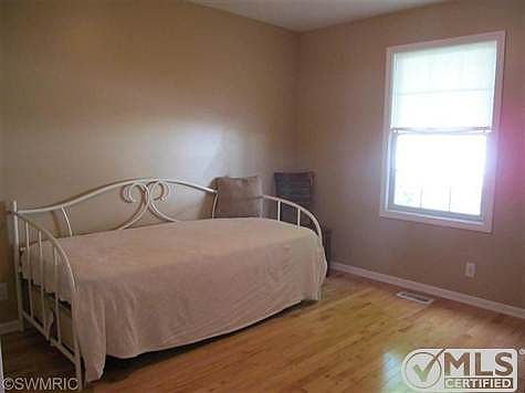 2nd Bedroom  nice wood flooring this room could also be used as an office this room is in the front of the condo.