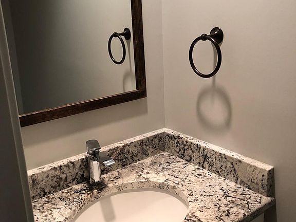 Powder room, 1/2 bath on main level.