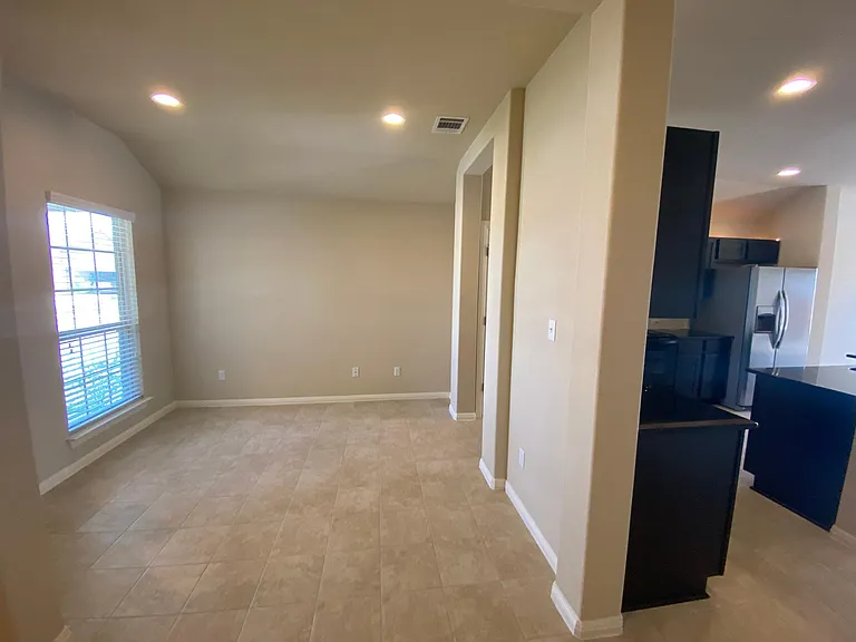 Dining room is to the left of the kitchen
