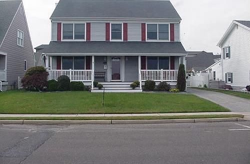 Cedar siding with mahogany porch