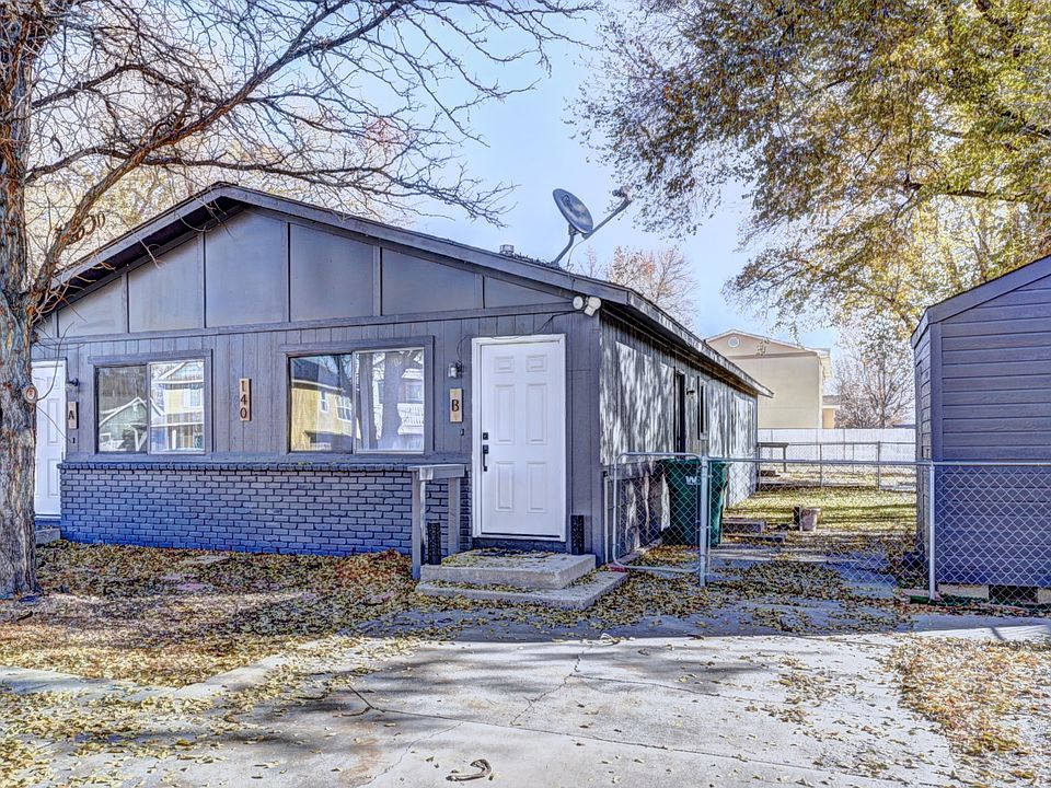 Unit A is on the front left side. Storage shed is to the right for yard items.