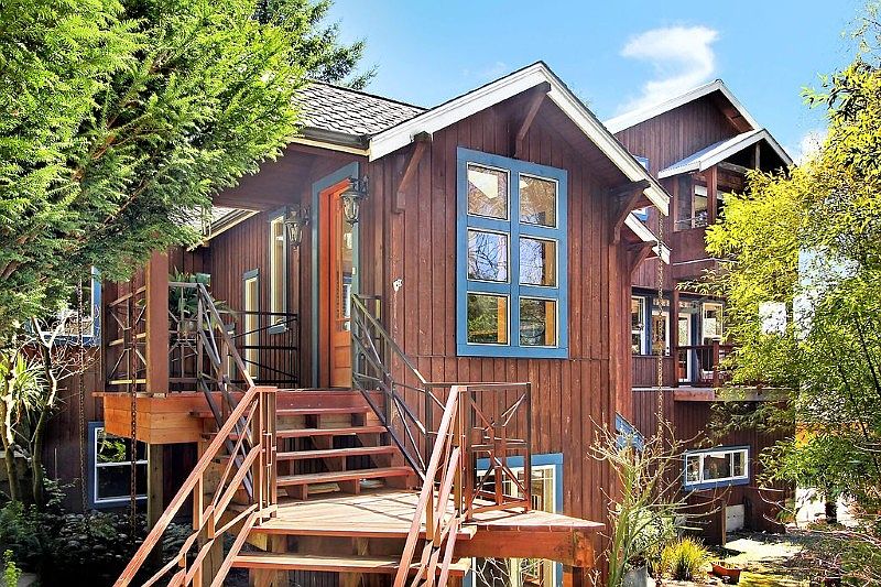 Meander down the stone path to this lodge-like custom home with a free flowing floor plan, an abundance of natural light, and exquisite use of materials. Every room has been well thought out to maximize the privacy, romance, and elegance of refined beach living. With radiant heat and air purifier for allergy free living! Don't miss the oversized 2 car garage and plenty of off street parking for boat or RV. This home also was designed for an elevator...the elevator shaft is in place!