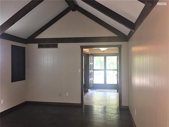 View from fireplace to front door.  Storage cabinet, perfect place for board games.
