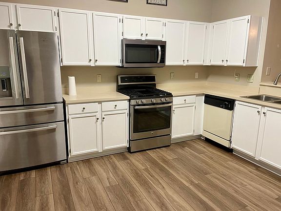 Big and bright working kitchen with a pantry