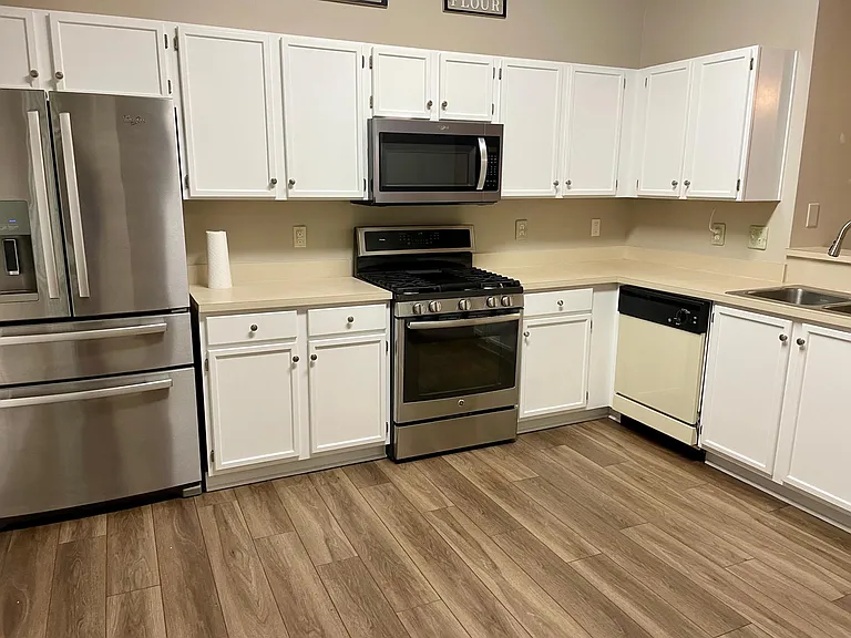 Big and bright working kitchen with a pantry