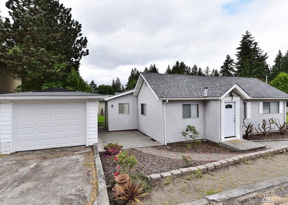 Front view with 1 car garage along with newer roof on house low up keep on the yard