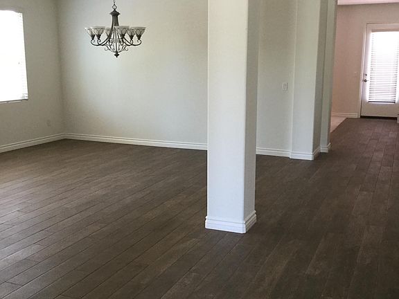 Great room and dining area leading into kitchen