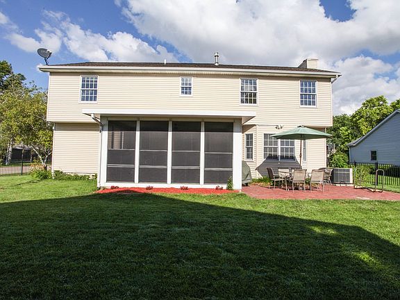 Exterior back showing enclosed porch/3 Seasons Room