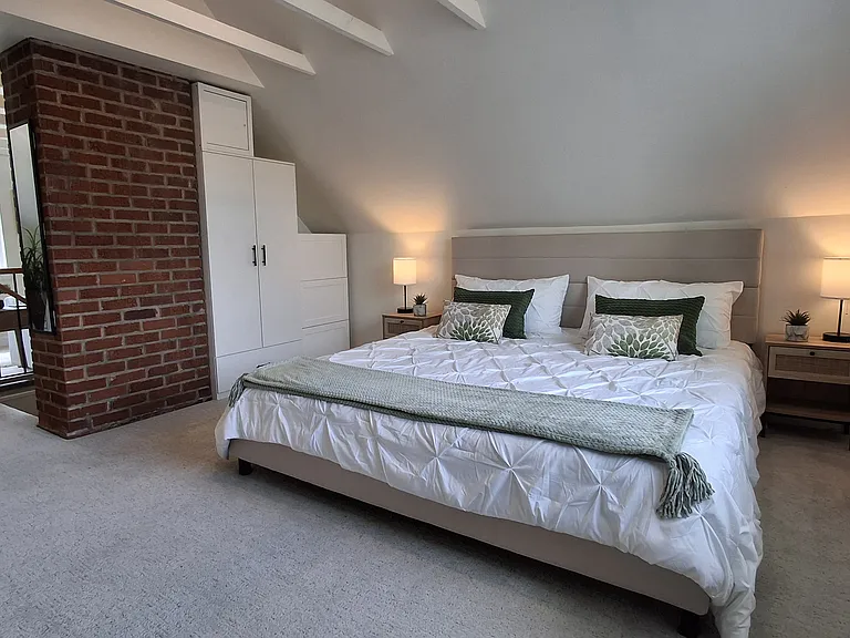 King-size bed with brand new blankets and pillows