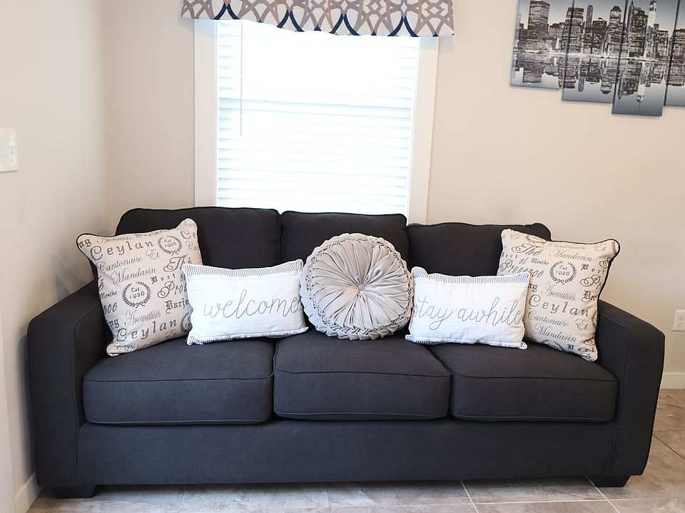 Comfortable living room with plush sofa and natural light.