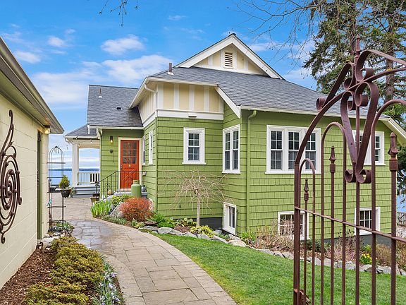Entrance from 3 car driveway and 2 car garage.