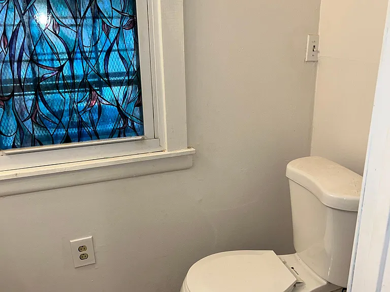 Pass the kitchen is the dining room and the half bath
