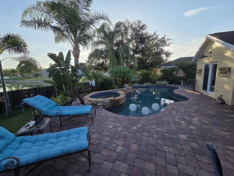 Custom pool with hot tub and waterfall