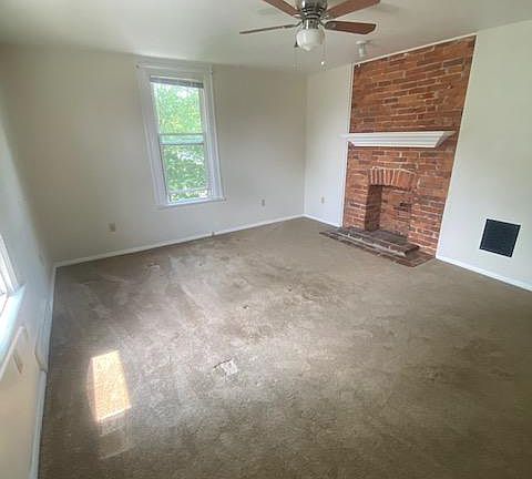 Living room, non-working fireplace.