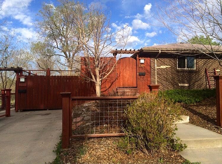 Front of duplex with off street parking spot