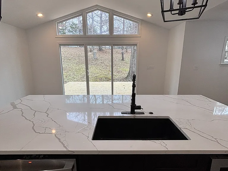 view to back yard/deck from kitchen island