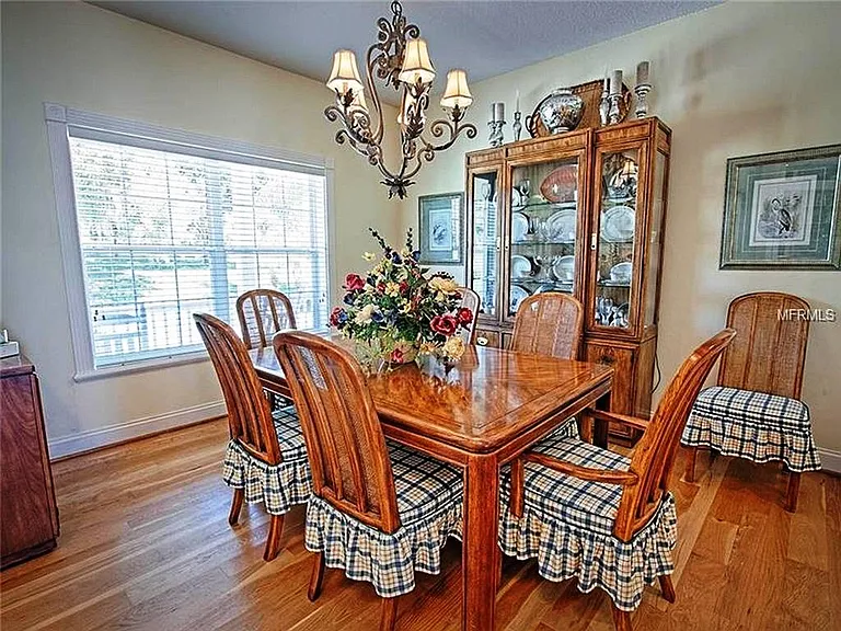 Note: the Dining Room furniture is not included. The dining room is next to the Foyer and kitchen and looks out across the wrap around porch and to the front yard.