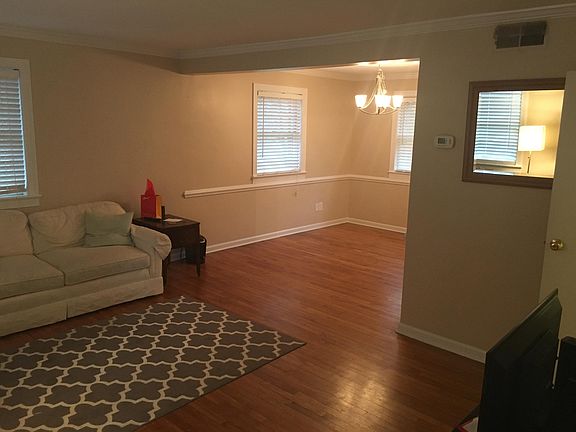 Living room (left) and dining area (forward).