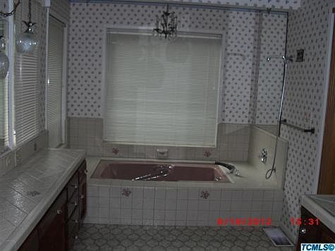 Jetted tub, with garden windows in Master Bath. LOTS of storage. Separate room with shower and 2nd sink.