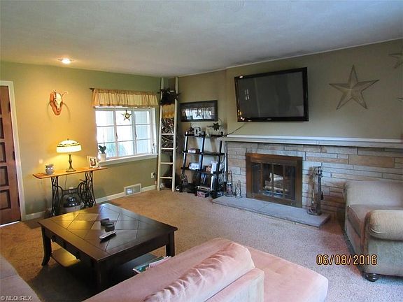 Roomy living room with fireplace.