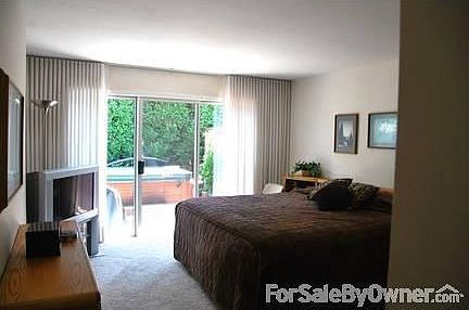 Mater Bedroom & exit to Hot Tub & Patio