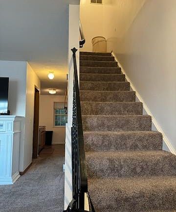 View from living room through to kitchen and upstairs to landing